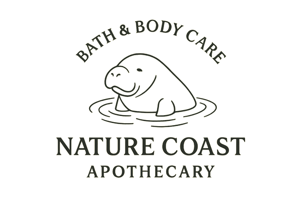 BATH & BODY CARE ARCHING OVER A LINE DRAWING OF A MANATEE. MANATEE HAS WATER RIPPLES FROM IT'S HEAD BREAKING THE SURFACE OF THE WATER.  NATURE COAST IN LARGER FONT APOTHECARY UNDER IT IN A SMALLER FONT. 