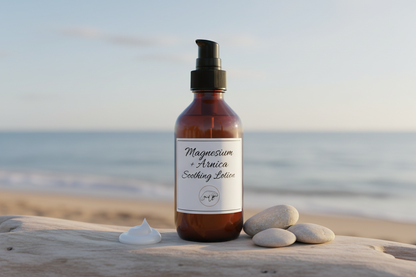 Magnesium + Arnica Soothing Lotion - 8oz amber glass bottle with black pump dispenser on coastal driftwood